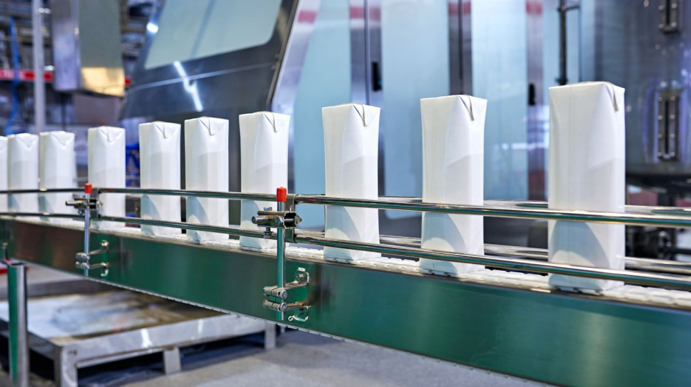 A conveyer belt carrying food packaging