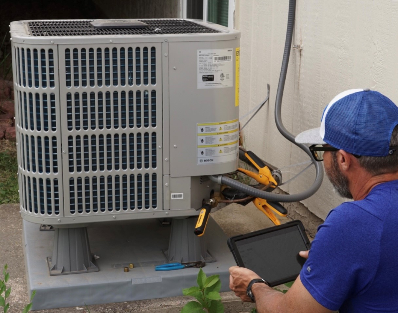 Technician checking an installed unit.