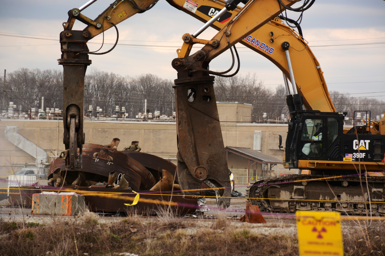 Excavators make quick work of shearing coolers from the X-333 Process Building at the Portsmouth Site.