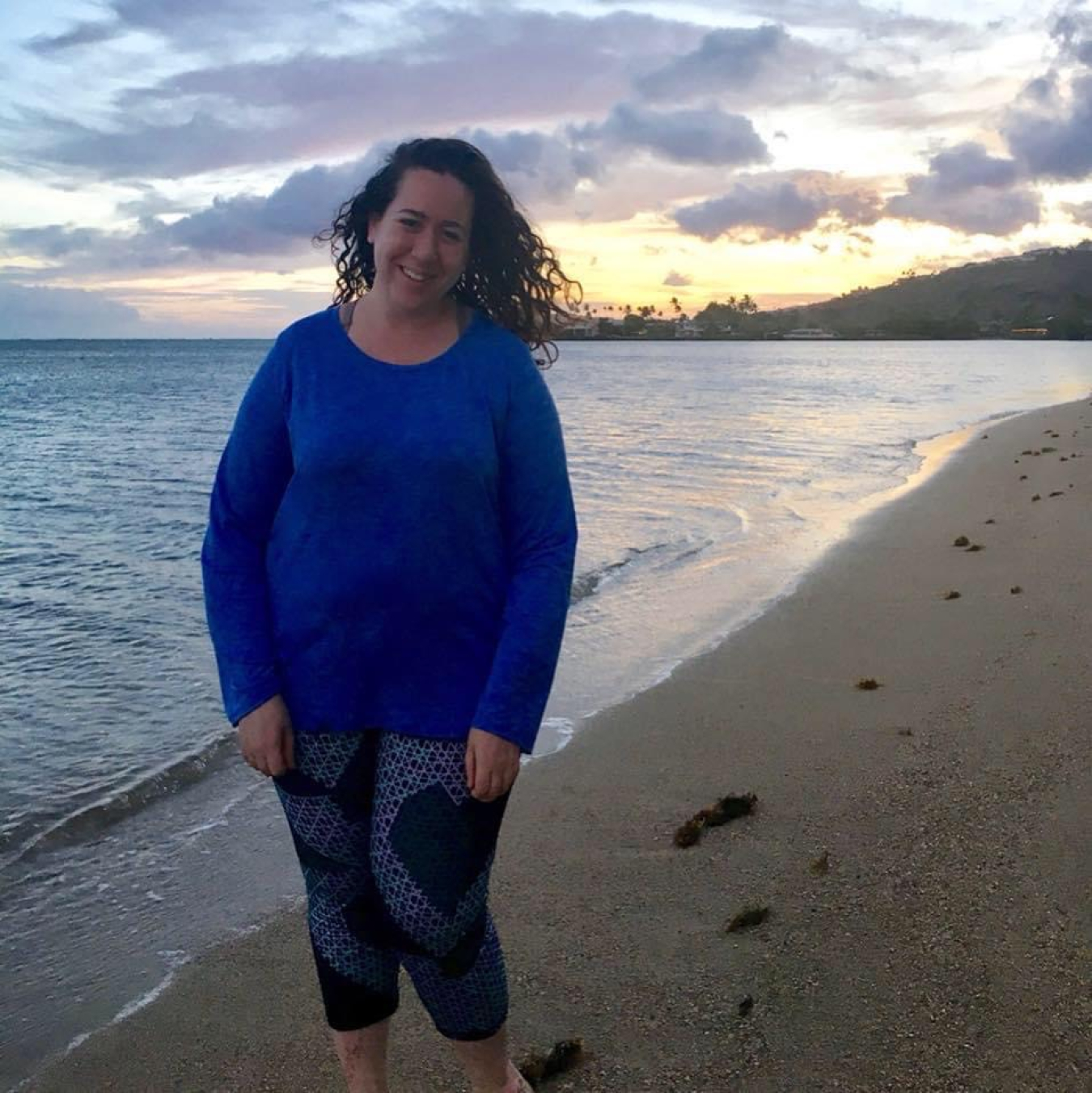 Nina Joffe standing on a beach.