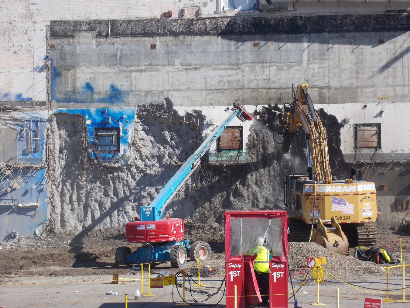 Workers take down a portion of a 5-foot-thick concrete wall of the Chemical Process Cell on the west side of the Main Plant Process Building at the West Valley Demonstration Project. The controlled demolition began in September.