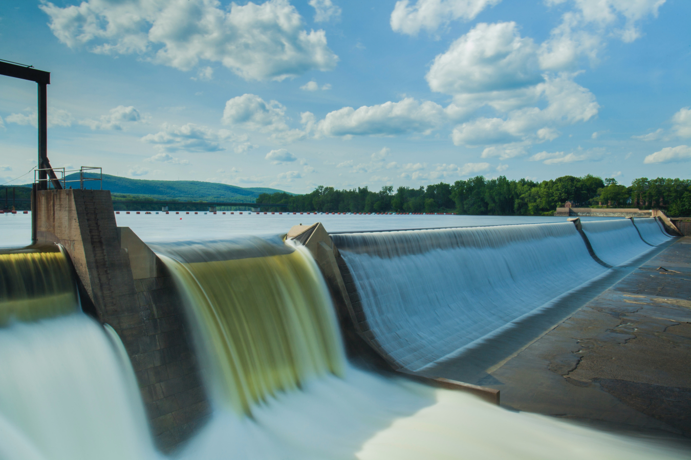 An inland body of water flows from higher elevation down to a lower elevation