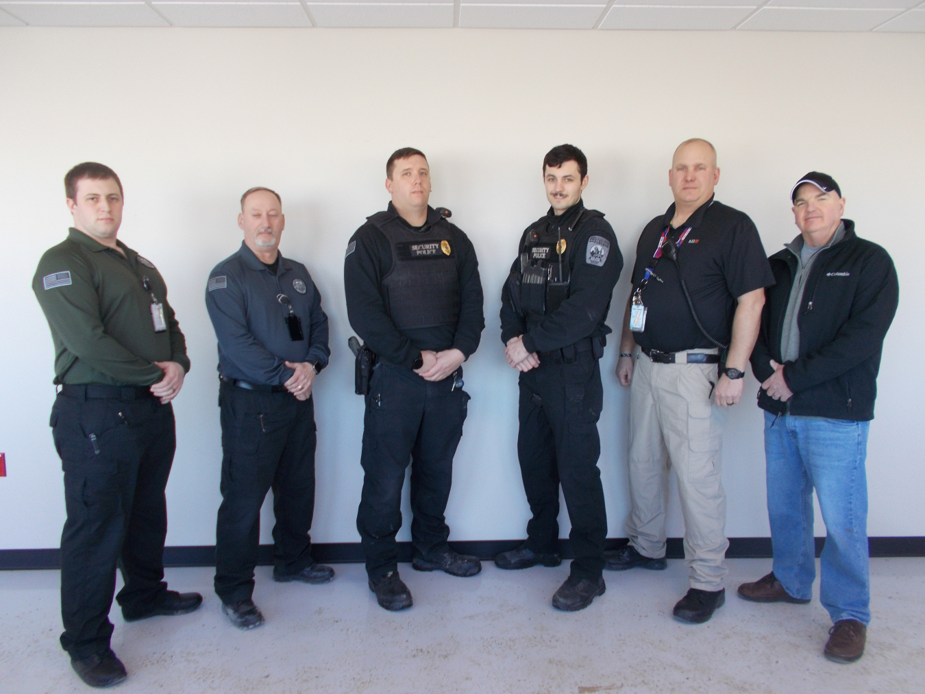 Richard Carson and Jonathan Zimmer are now EM West Valley Demonstration Project (WVDP) security police officers after completing training at DOE’s National Training Center. From left are WVDP Protective Force Lt. James Madsen, WVDP Protective Force Capt. James Madden, Carson, Zimmer, CH2M HILL BWXT West Valley Safeguards and Security Manager Dave Schuman and WVDP Security Manager Mark Simsick.