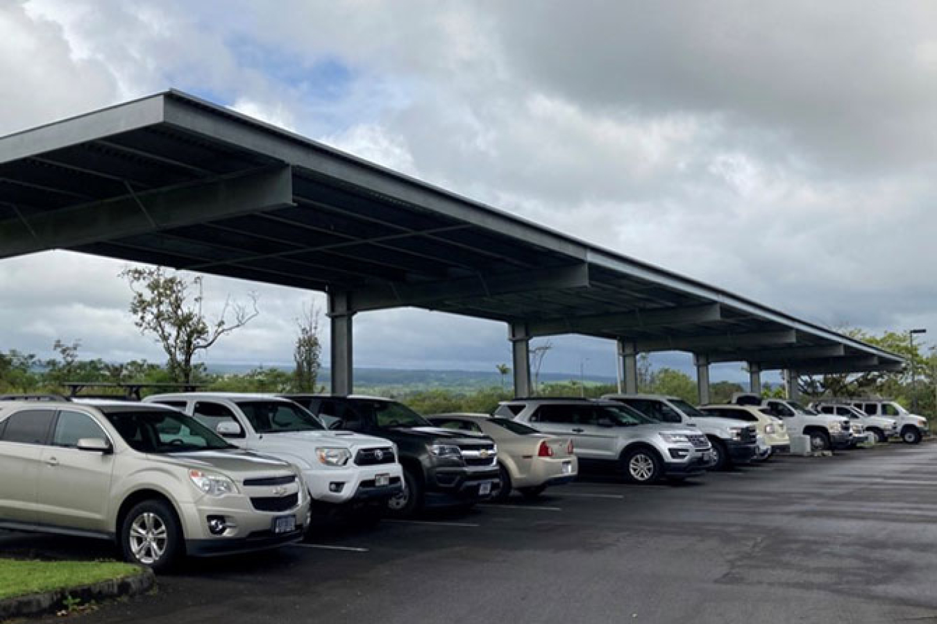 Cars parked under a carport.