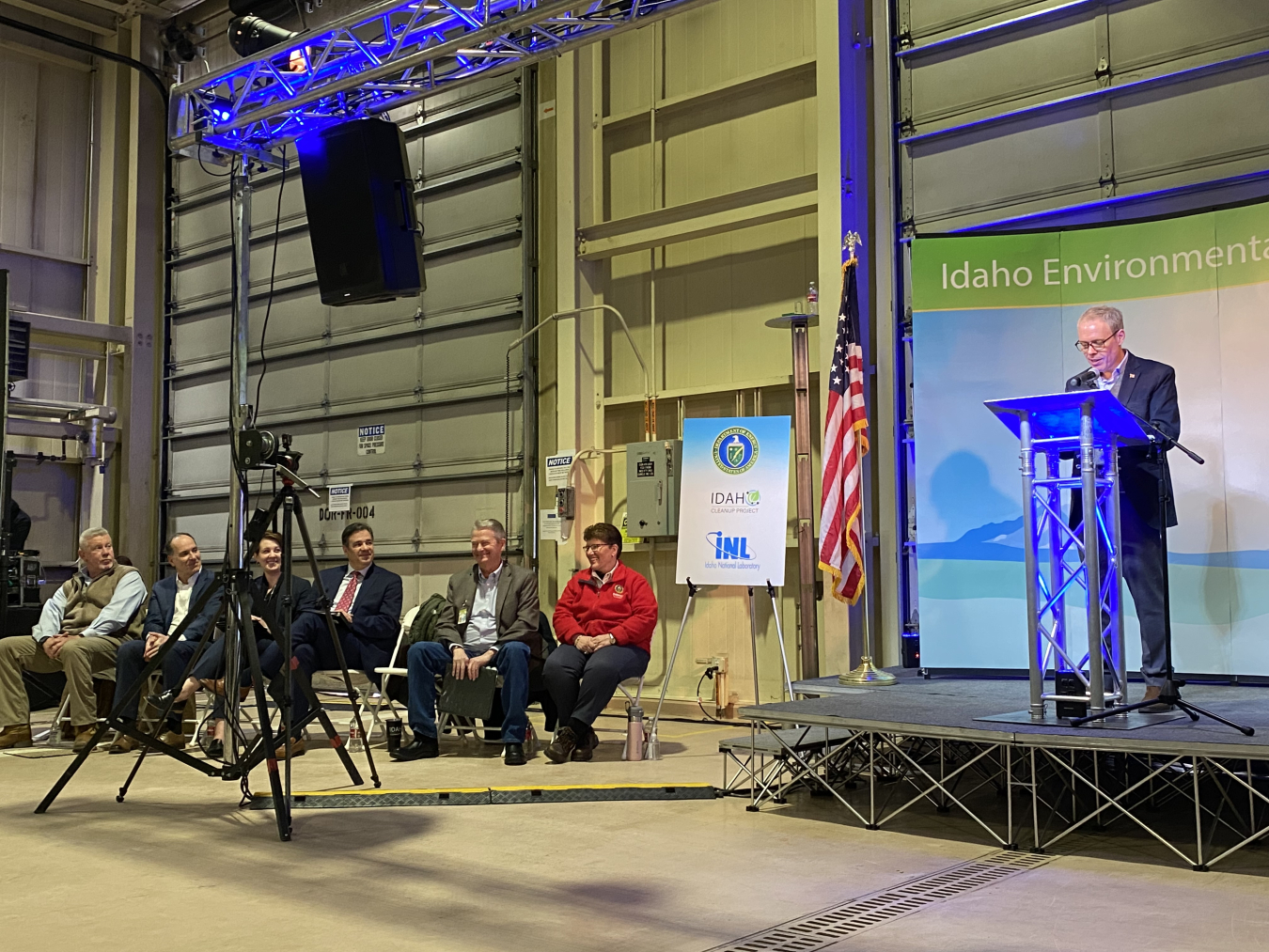 Dignitaries speaking at the podium