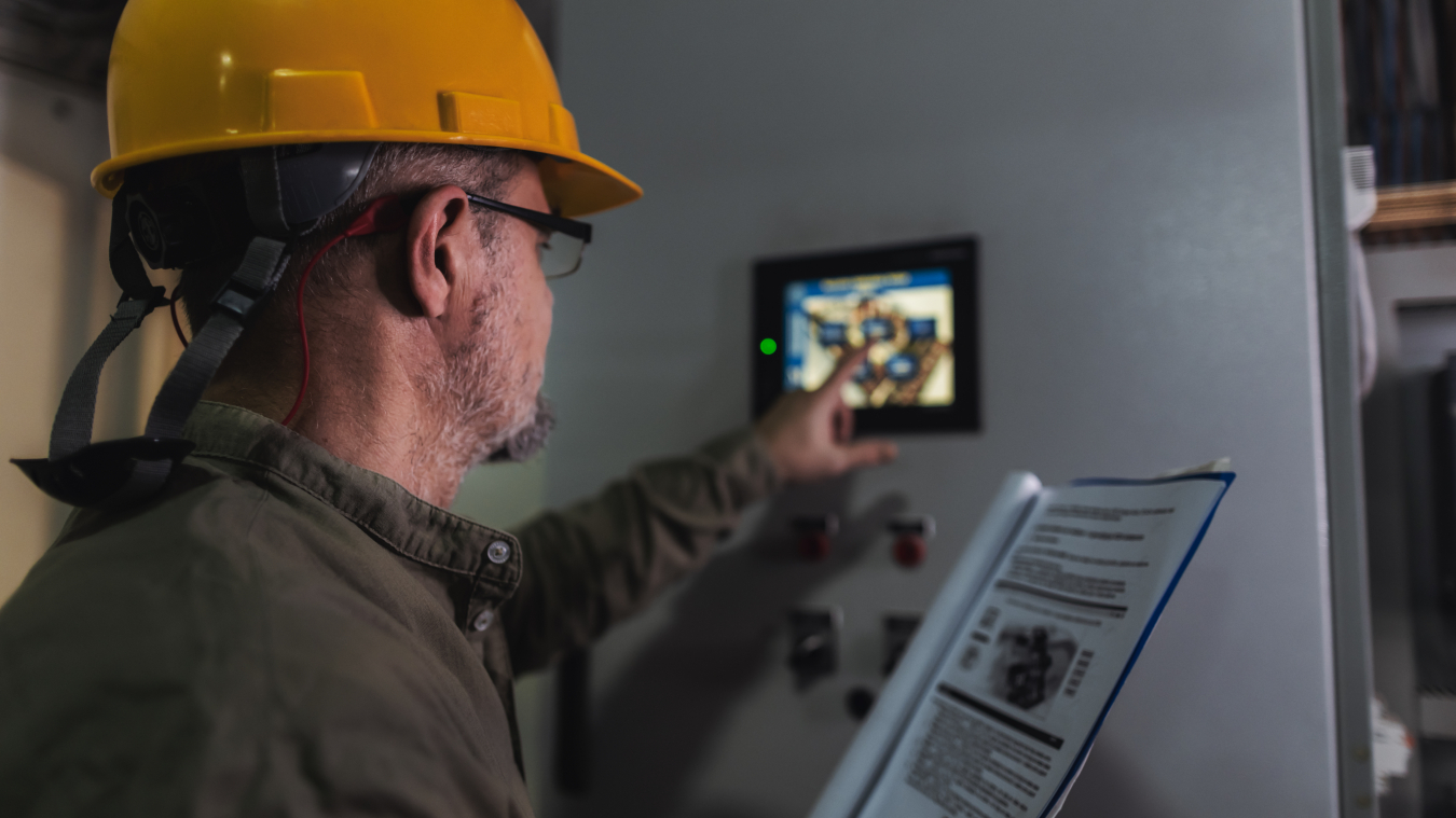 Worker checking thermostat