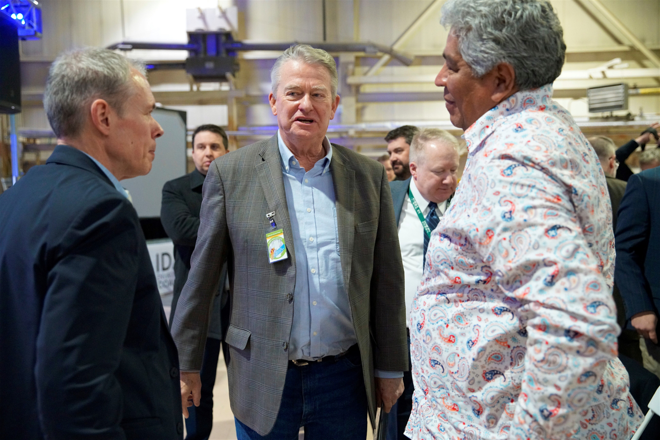 EM Senior Advisor William “Ike” White, left, greets Ladd Edmo, a member of the Fort Hall Business Council of the Shoshone-Bannock Tribes, right, and Idaho Gov. Brad Little at the celebration. 