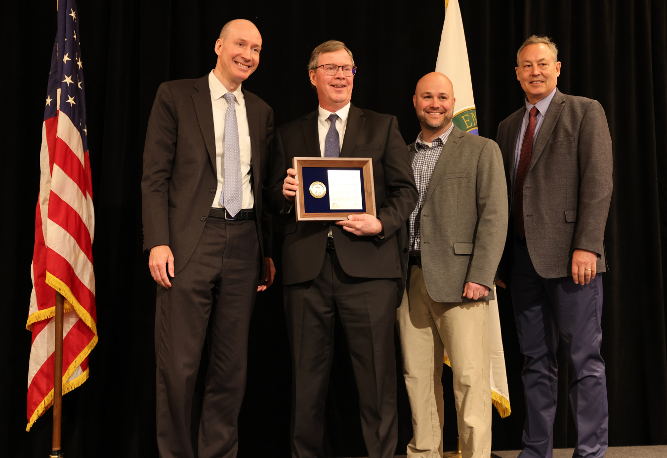 Deputy Energy Secretary David Turk, from left, presents the DOE Project Management Excellence Award for the On-Site Waste Disposal Facility Capital Asset Project-1 to Portsmouth Federal Project Director Jud Lilly, Portsmouth Site Lead Jeremy Davis and Portsmouth/Paducah Project Office Manager Joel Bradburne during a ceremony last week.