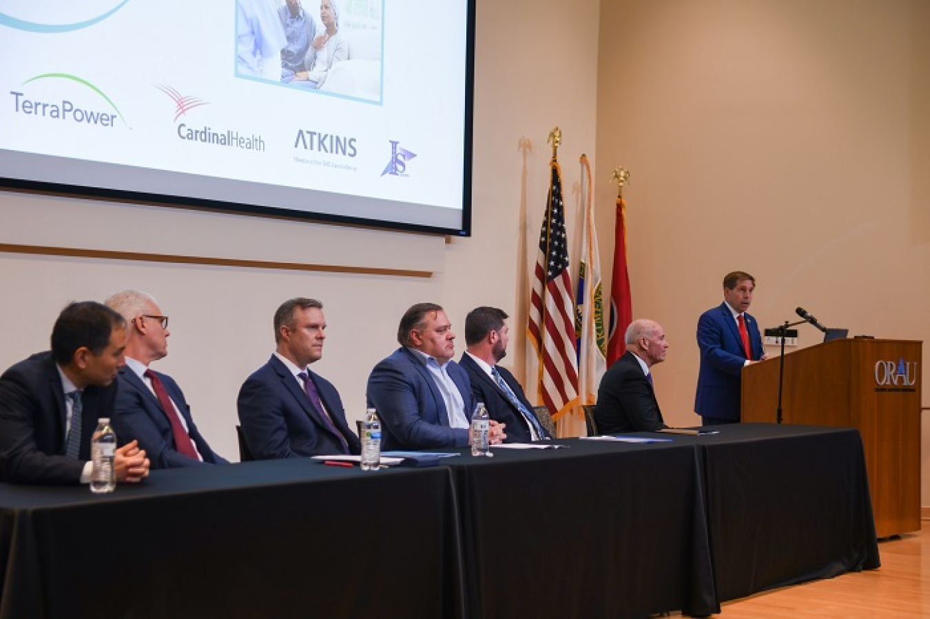 U.S. Rep. Chuck Fleischmann provides remarks at the “No One Fights Alone” event. Others who spoke during the program, from left, included Dr. Ken Song, president and CEO, RayzeBio; Mike Pintek, president, Nuclear & Precision Health Solutions, Cardinal Health; Scott Claunch, president, TerraPower Isotopes Program; Joe St. Julian, president, Nuclear, SNC-Lavalin; Jeff Avery, EM principal deputy assistant secretary; and Jim Bolon, president, Isotek Systems.