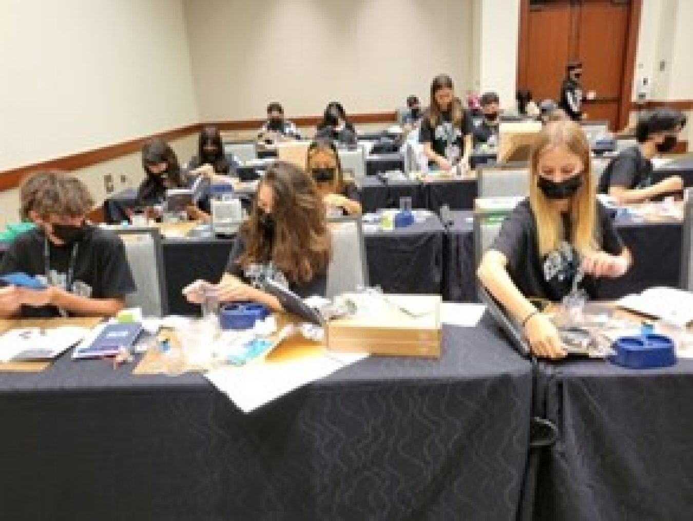 Students in a classroom with lab kits.