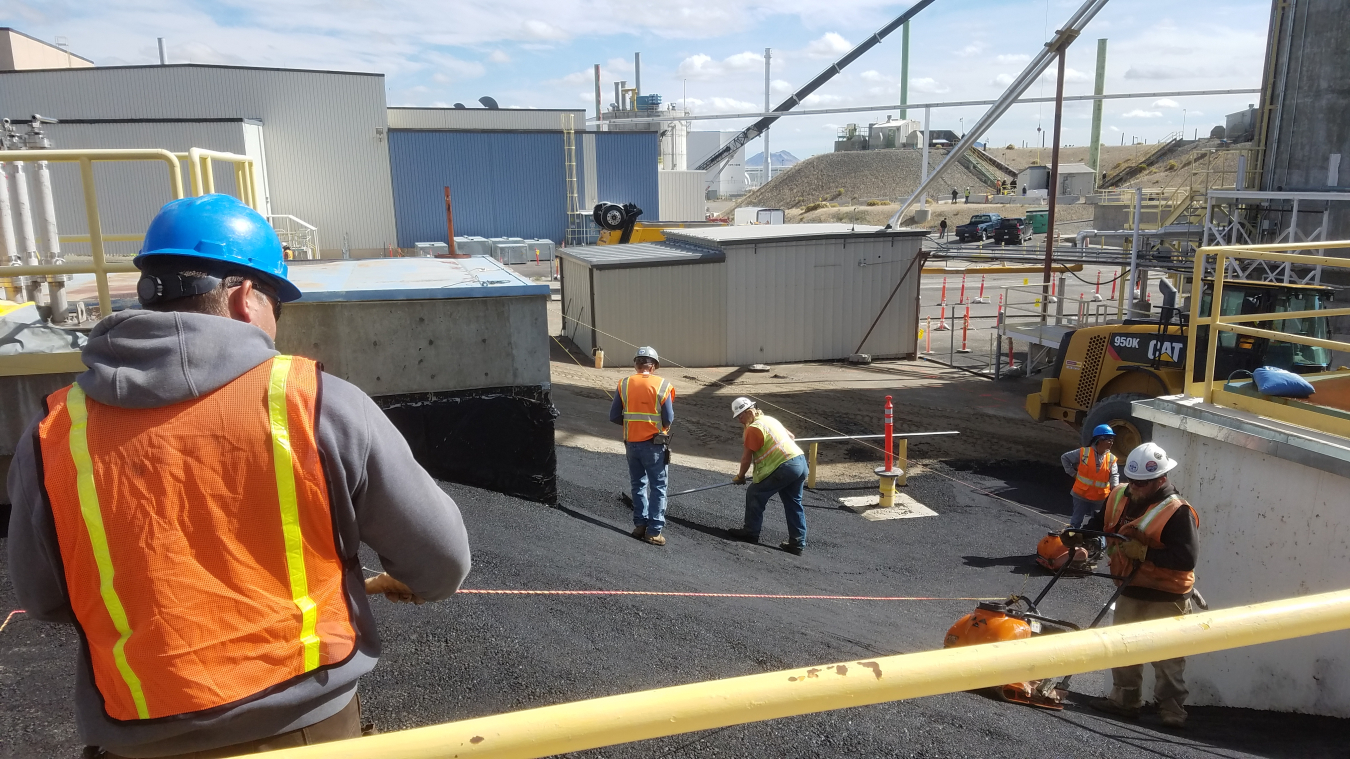An interim cap over the tank farm at the Idaho Nuclear Technology and Engineering Center serves to channel water away from the site to protect the underlying Snake River Plain Aquifer.