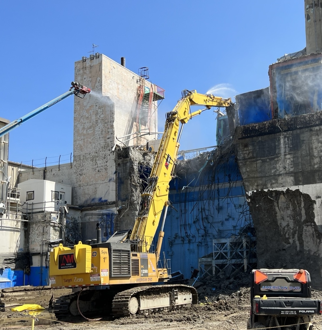 An operator uses an excavator with a hydraulic hammer to dismantle the Chemical Process Cell, as part of the deconstruction of the Main Plant Process Building at EM’s West Valley Demonstration Project.