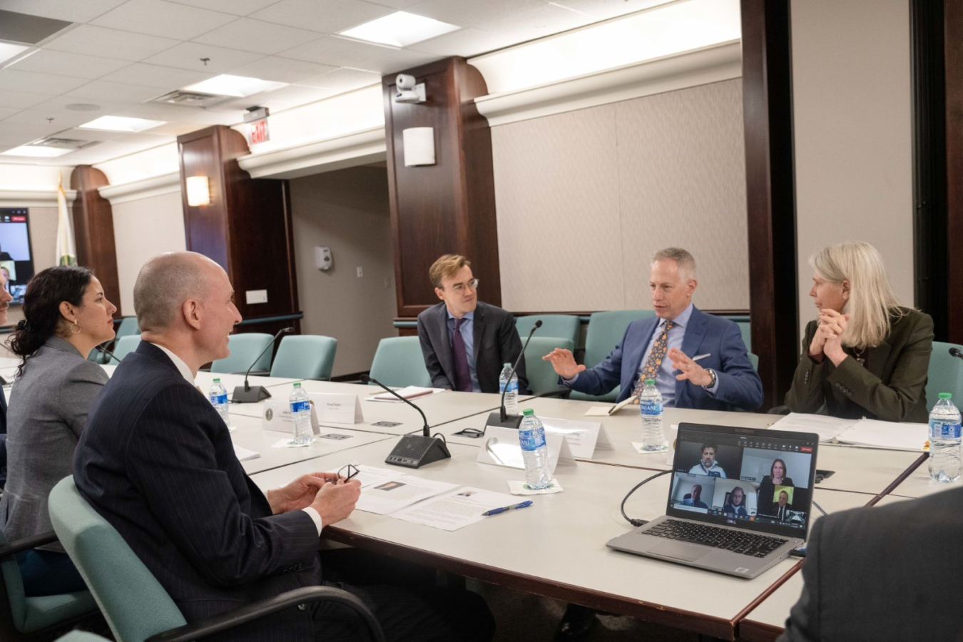 U.S. Deputy Secretary of Energy David Turk, Department officials, and U.S. Ambassador to Saudi Arabia Michael Ratney sit at a table in a conference room during a meeting.