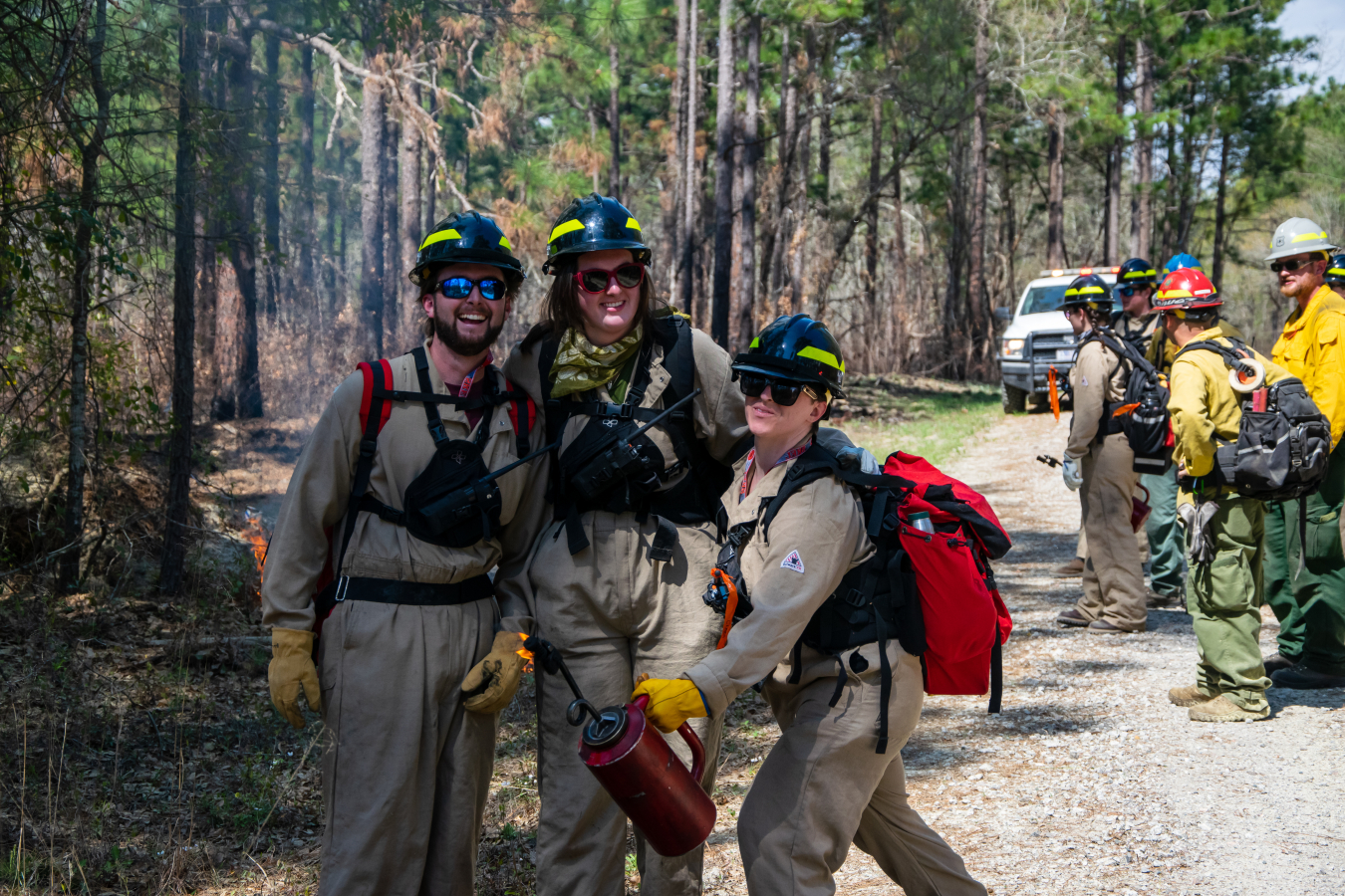 University of Georgia students pause for a photo as they participate in a prescribed burn of land at the Savannah River Site.