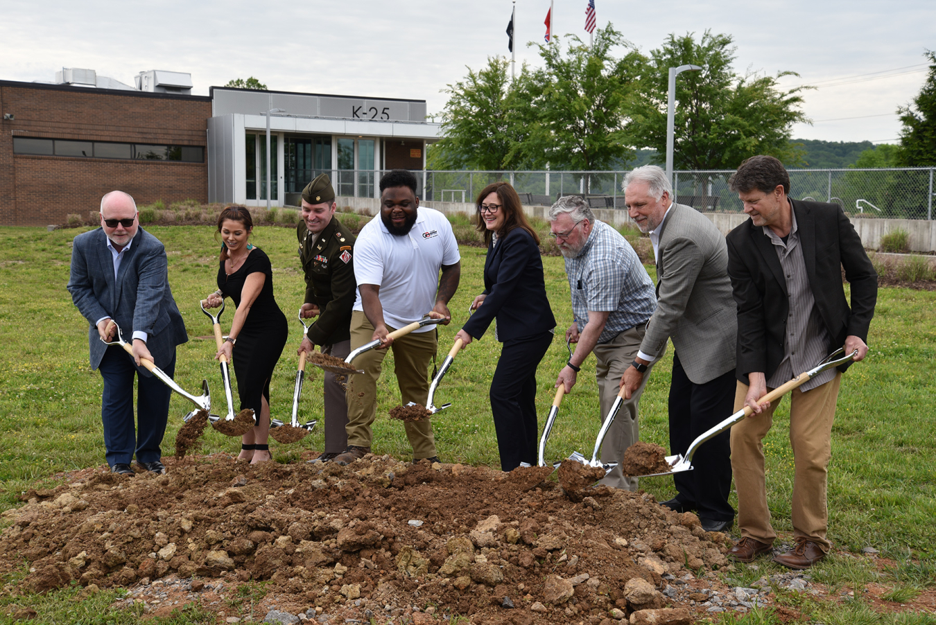 From left, American Museum of Science and Energy Director Alan Lowe; Roane County representative Bonnie Argus; U.S. Army Corps of Engineers Nashville District Deputy Commander Maj. Todd Mainwaring; Geiger Brothers Project Engineer Ian Fitzpatrick; Oak Ridge Office of Environmental Management Deputy Manager Laura Wilkerson; Oak Ridge Historian Ray Smith; UCOR President and CEO Ken Rueter; and Gregor Smee, Smee + Busby Architects break ground on the K-25 Viewing Platform.