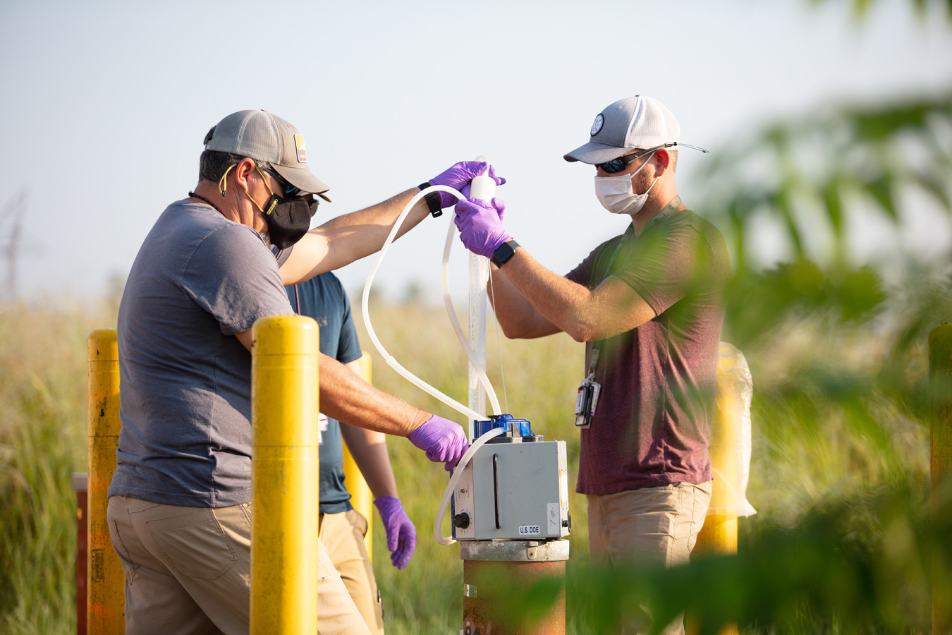 Employees take groundwater samples at the East Tennessee Technology Park to understand which areas require further action. The site is divided into three sections for groundwater remediation planning — the Main Plant Area, K-31 and K-33 Area and Zone 1.