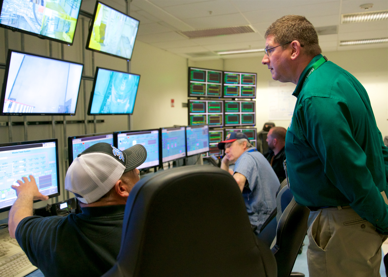 Greg Sosson, at right, EM deputy assistant secretary for safety, security and quality assurance, speaks with an Integrated Waste Treatment Unit operator during the facility’s first day of radiological operations last month at the Idaho National Laboratory Site.