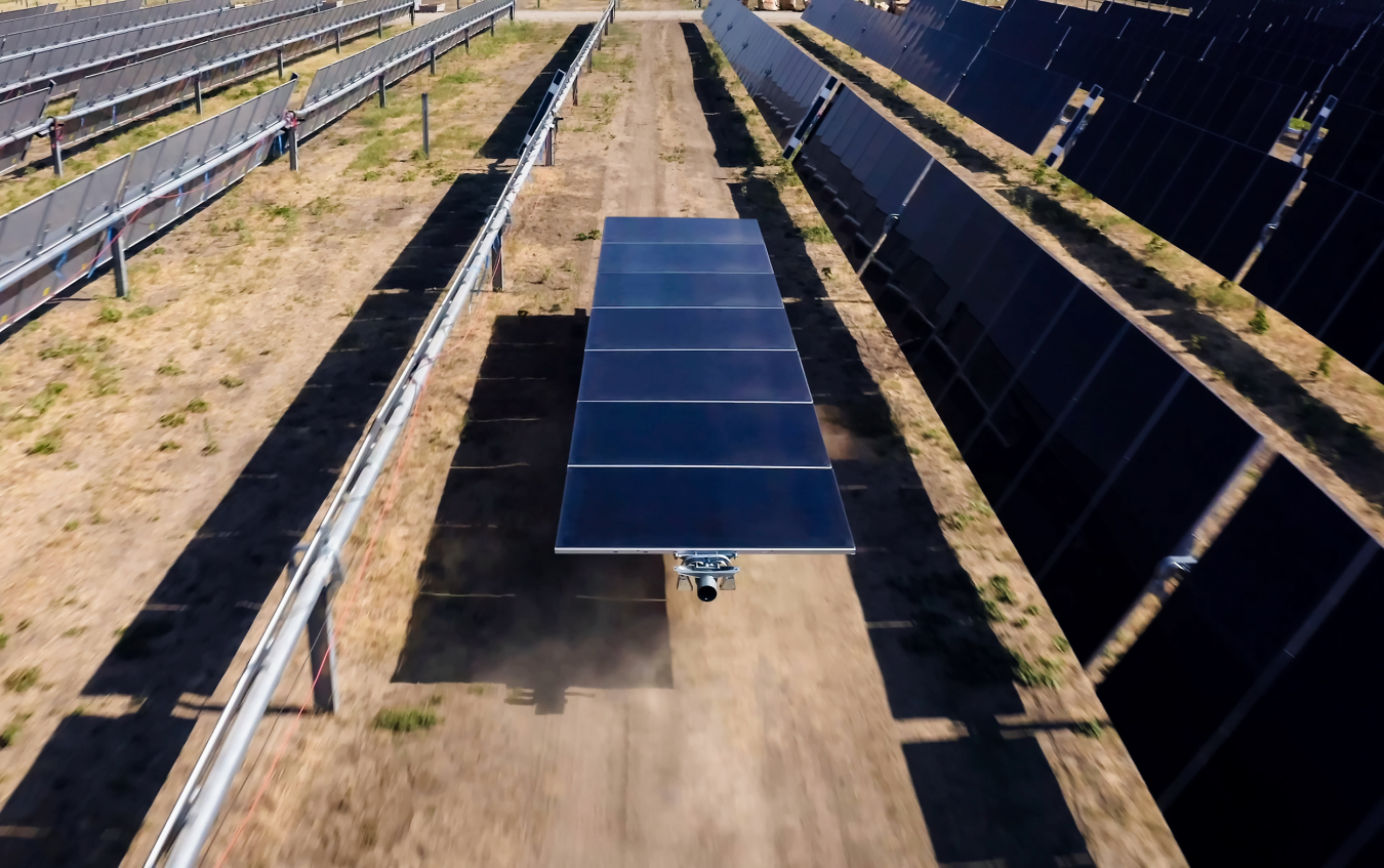 Rovers deliver solar panels to the Terabase field factory.