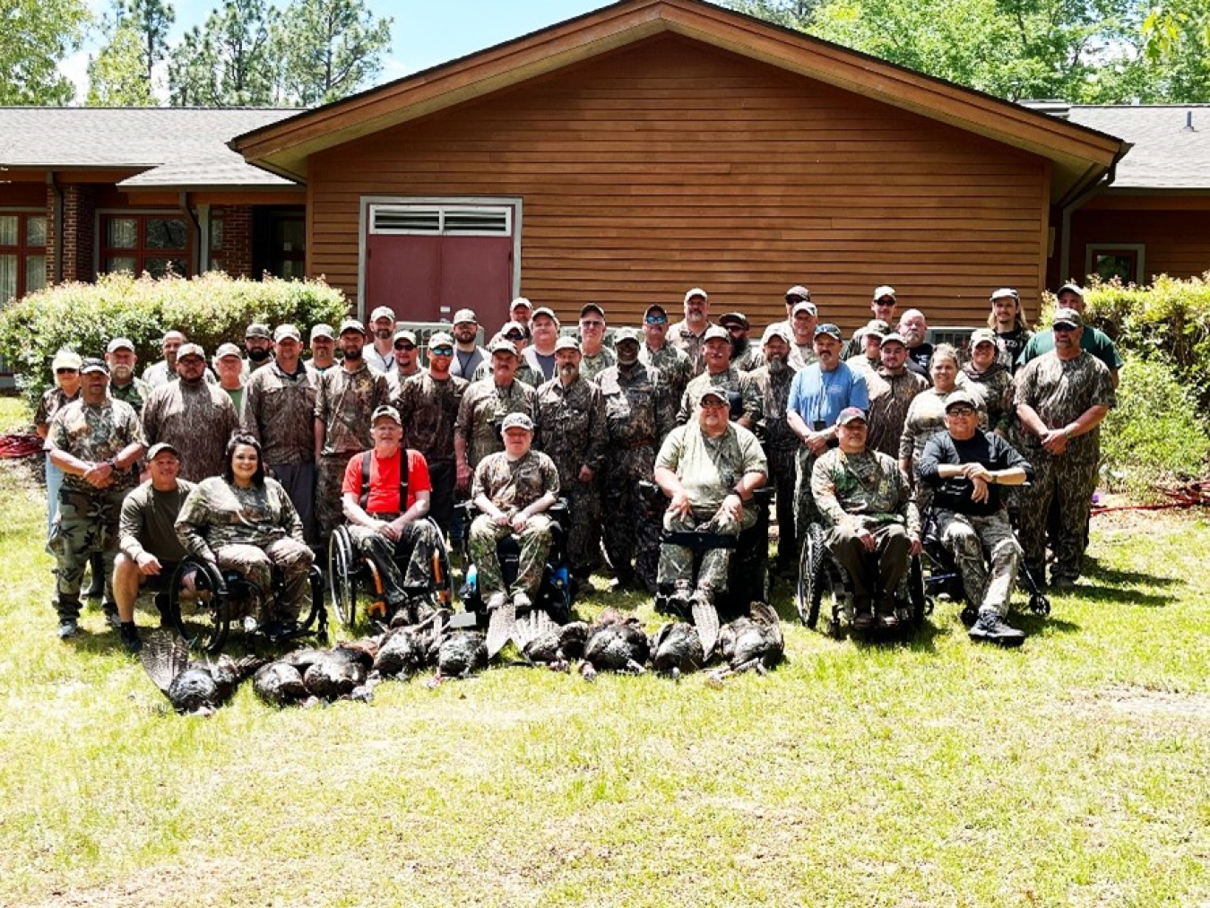 Hunters gather at the end of the first day's hunt on the Savannah River Site for a group photo. - U.S. Department of Agriculture image.
