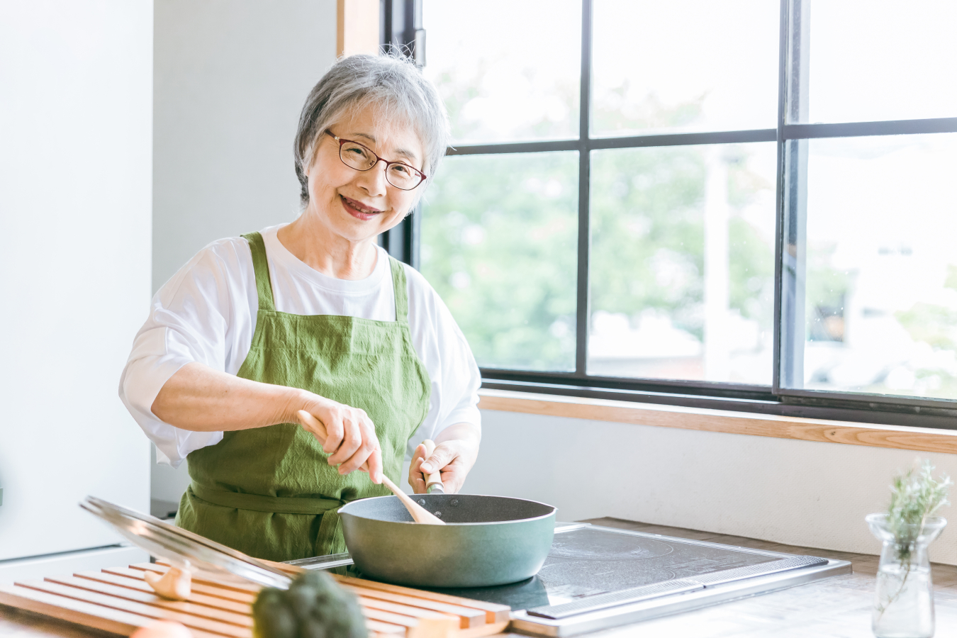 A person cooking on an induction stovetop
