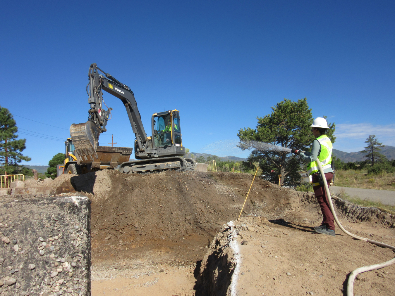 Environmental crew members conduct excavation to clean up contamination in Lower Water Canyon near one of Los Alamos National Laboratory’s Cold War-era underground explosives firing chambers.