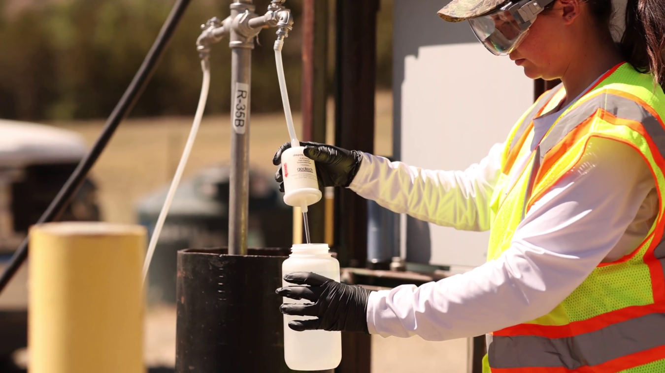 A technical crew member collects a groundwater monitoring well sample, which is screened for hexavalent chromium and other contaminants of concern.