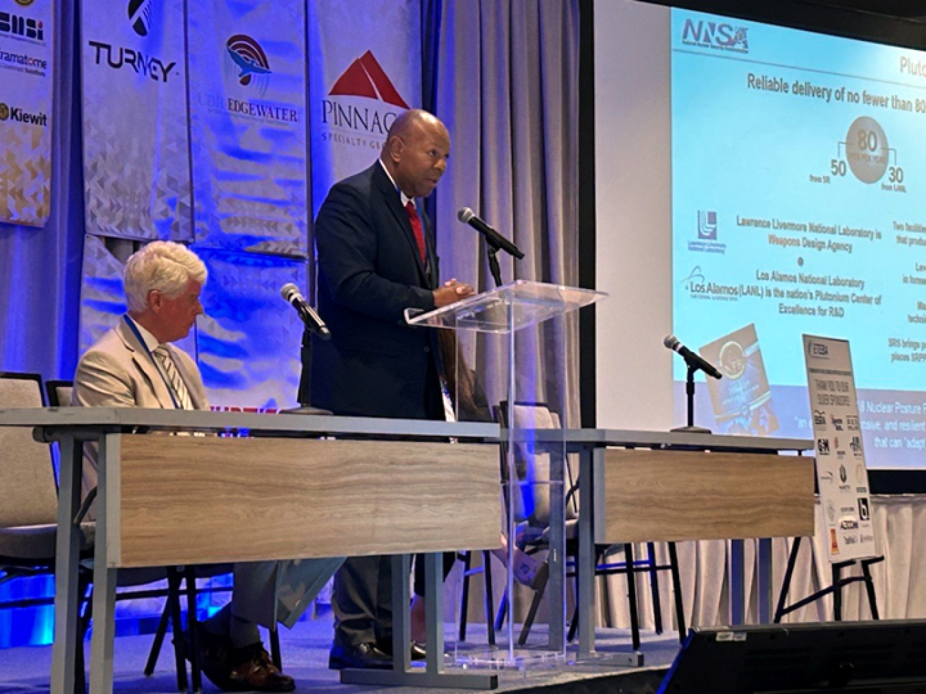 Mike Budney, manager of DOE’s Savannah River Operations Office, seated, and Jeff Allison, deputy manager of the National Nuclear Security Administration-Savannah River Field Office, discuss the status of Savannah River Site operations.