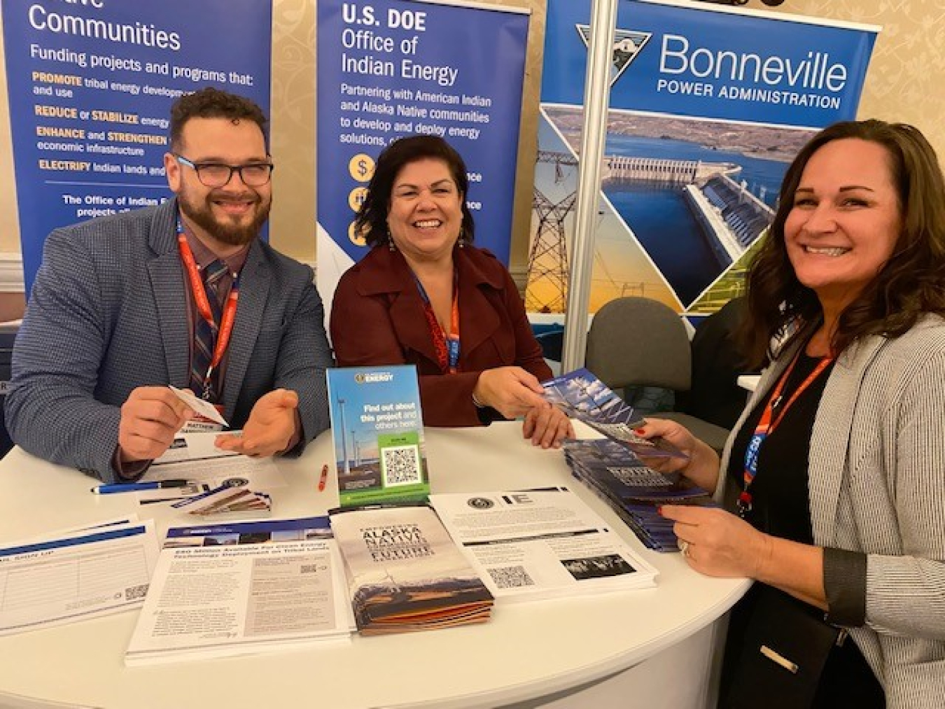 Jill Conrad, EM Tribal Program Manager, and Mathew Dannenberg, DOE Tribal Liaison, talk with a tribal business owner at the Reservation Economic Summit in Las Vegas.