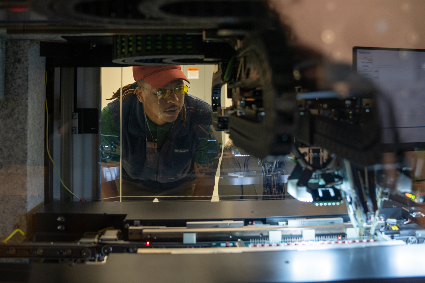 Spencer Gordon, a student from Tennessee State University, explores Savannah River National Laboratory’s flying probe machine in the process of reverse engineering while participating in the job shadowing and collaborative workshop event at the laboratory.