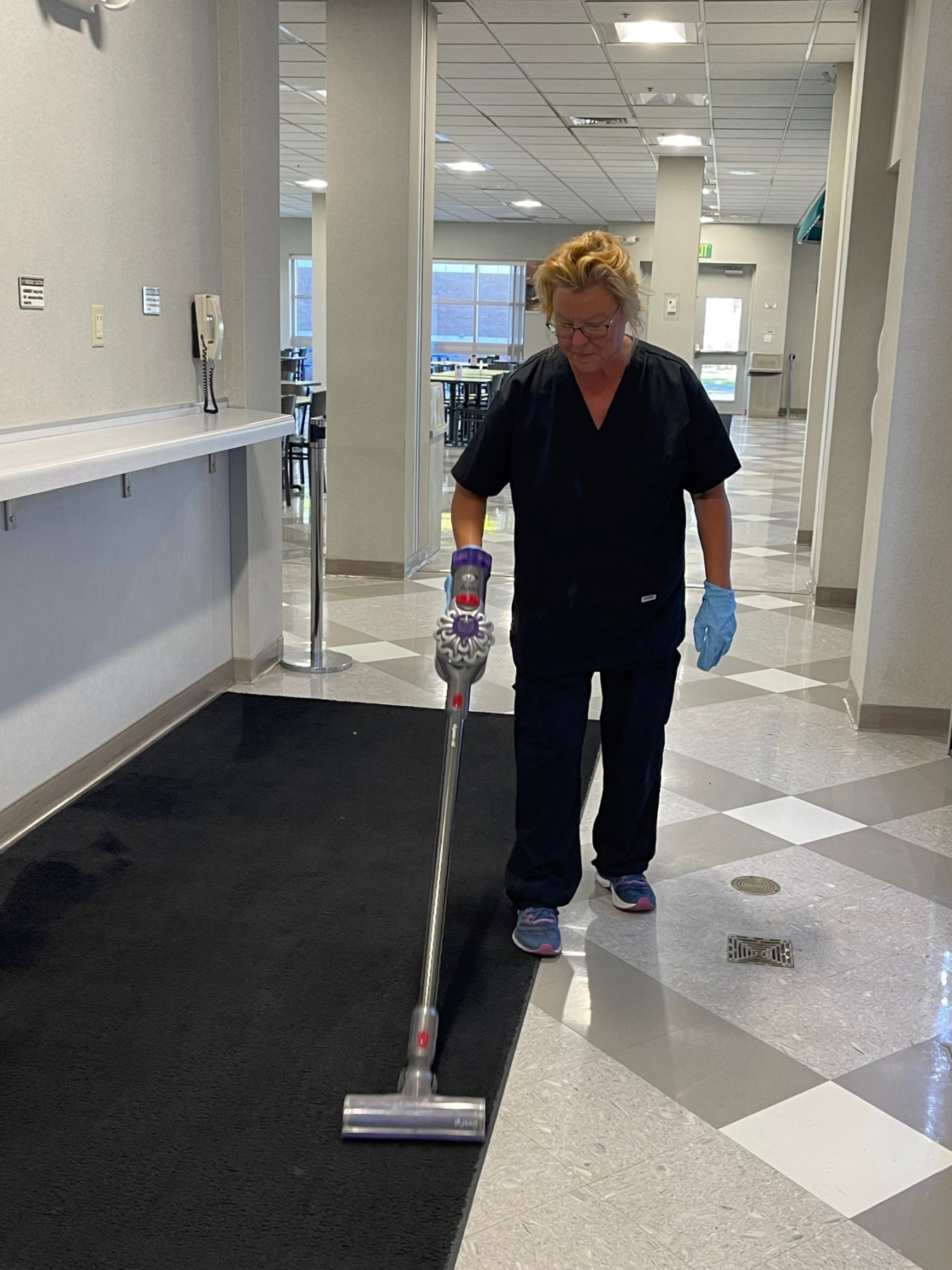 Tamara Balch, a member of the custodial services team for contractor Hanford Mission Integration Solutions (HMIS), helps with upkeep for a building on the Hanford Site. HMIS recently noticed a “workforce pipeline” within this team and documented dozens of custodial services employees who accepted new positions elsewhere on the Hanford Site.