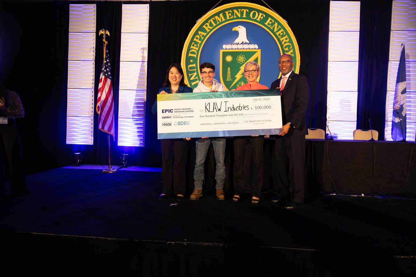 OTT Director & Chief Commercialization Officer Dr. Vanessa Chan, Klaw Industries Co-Founder Jacob Kumpon, Secretary of Energy Jennifer Granholm, and Director of Office of Small And Disadvantaged Business Utilization Ron Pierce.
