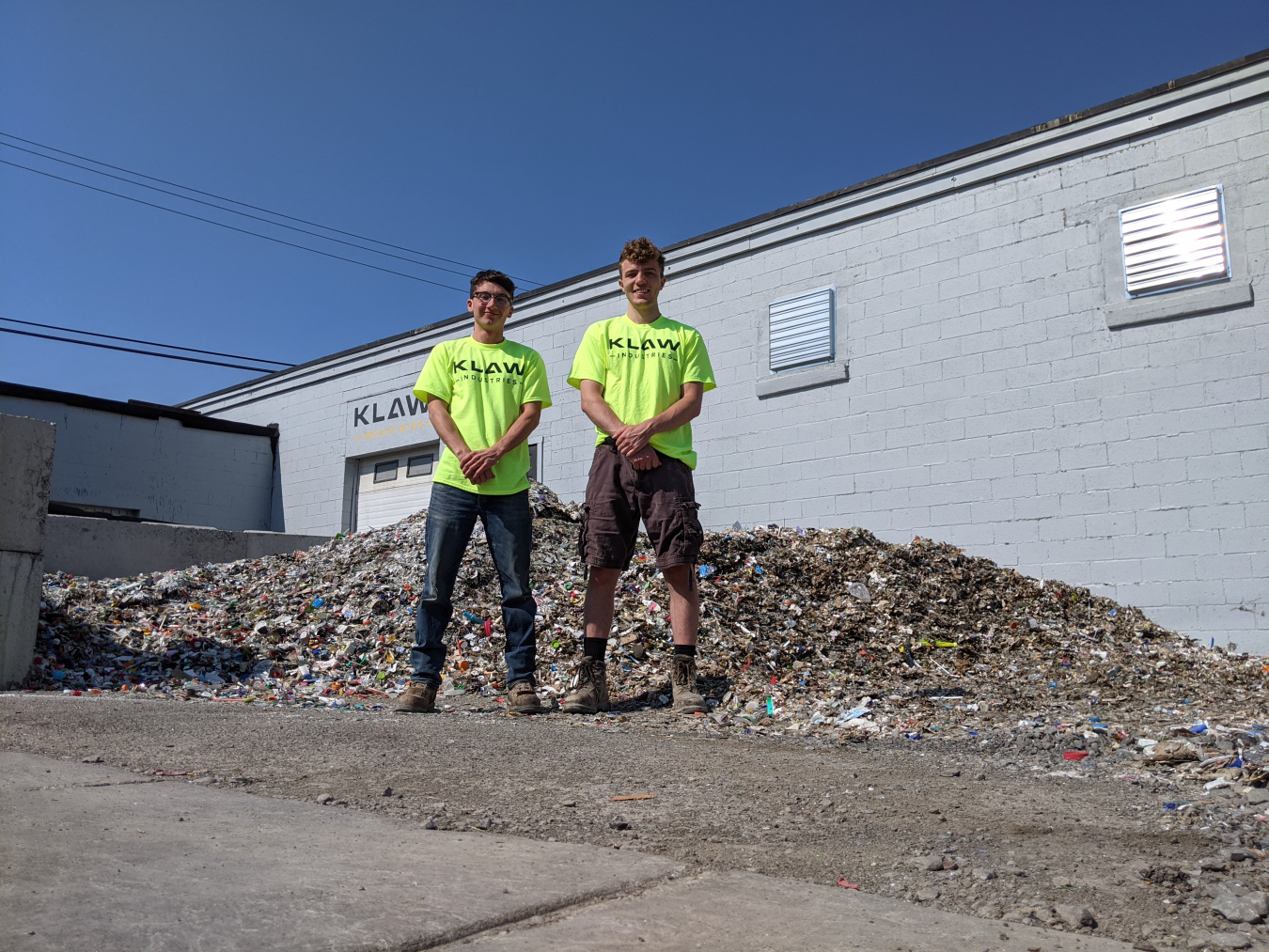 Cofounders Jacob and Jack in front of KLAW Industries pilot plant in Binghamton, New York.