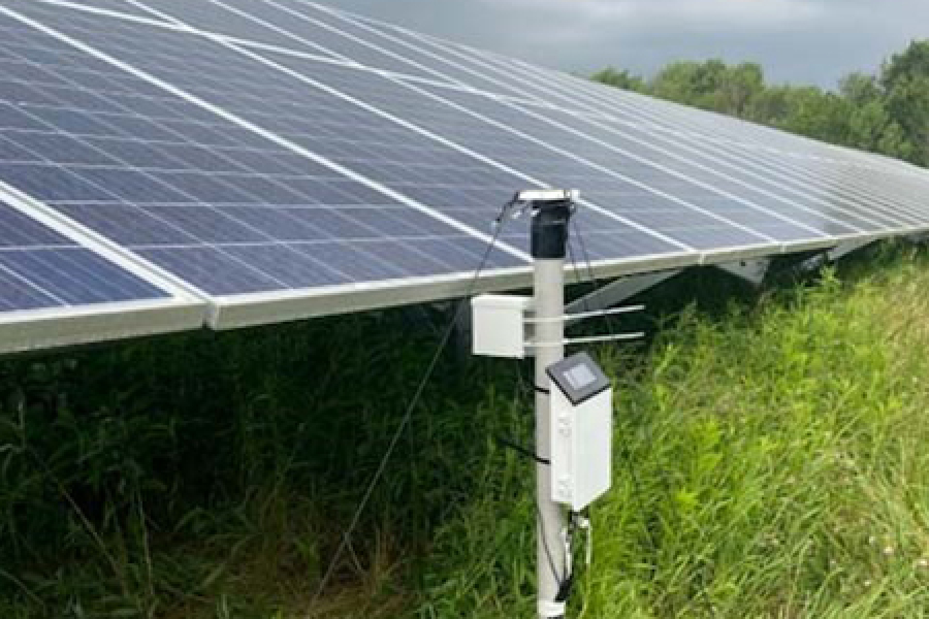 Field testing equipment monitors underground soil moisture at a New York solar facility.