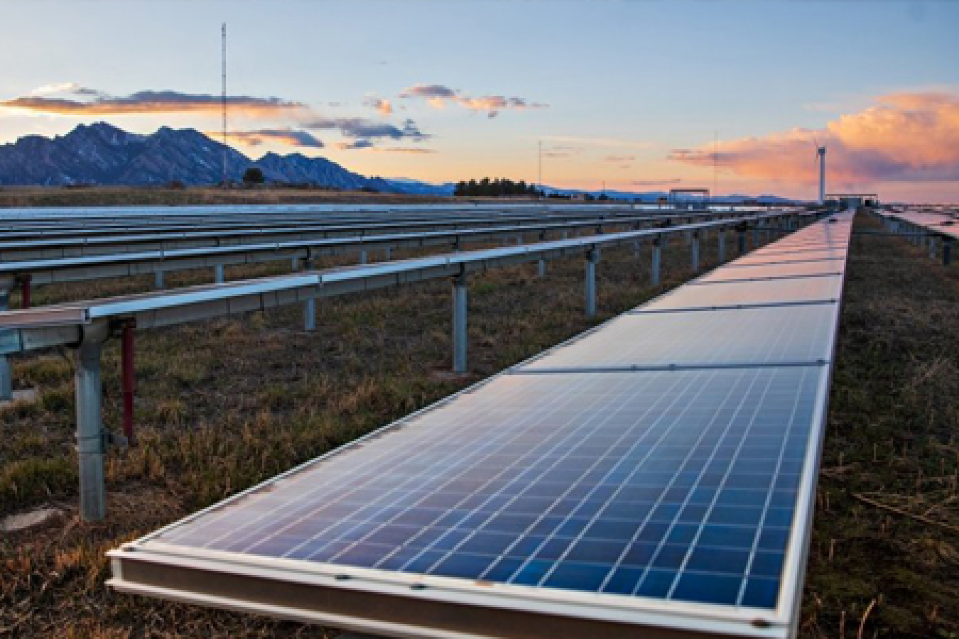 The sun sets on a photovoltaics array in the mountains at the National Renewable Energy Laboratory (NREL) in Colorado.