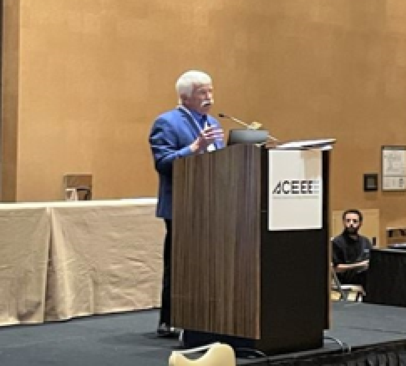 Bob Bechtold standing behind a podium