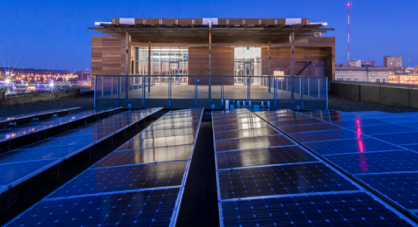 Solar panels on a building's roof at night