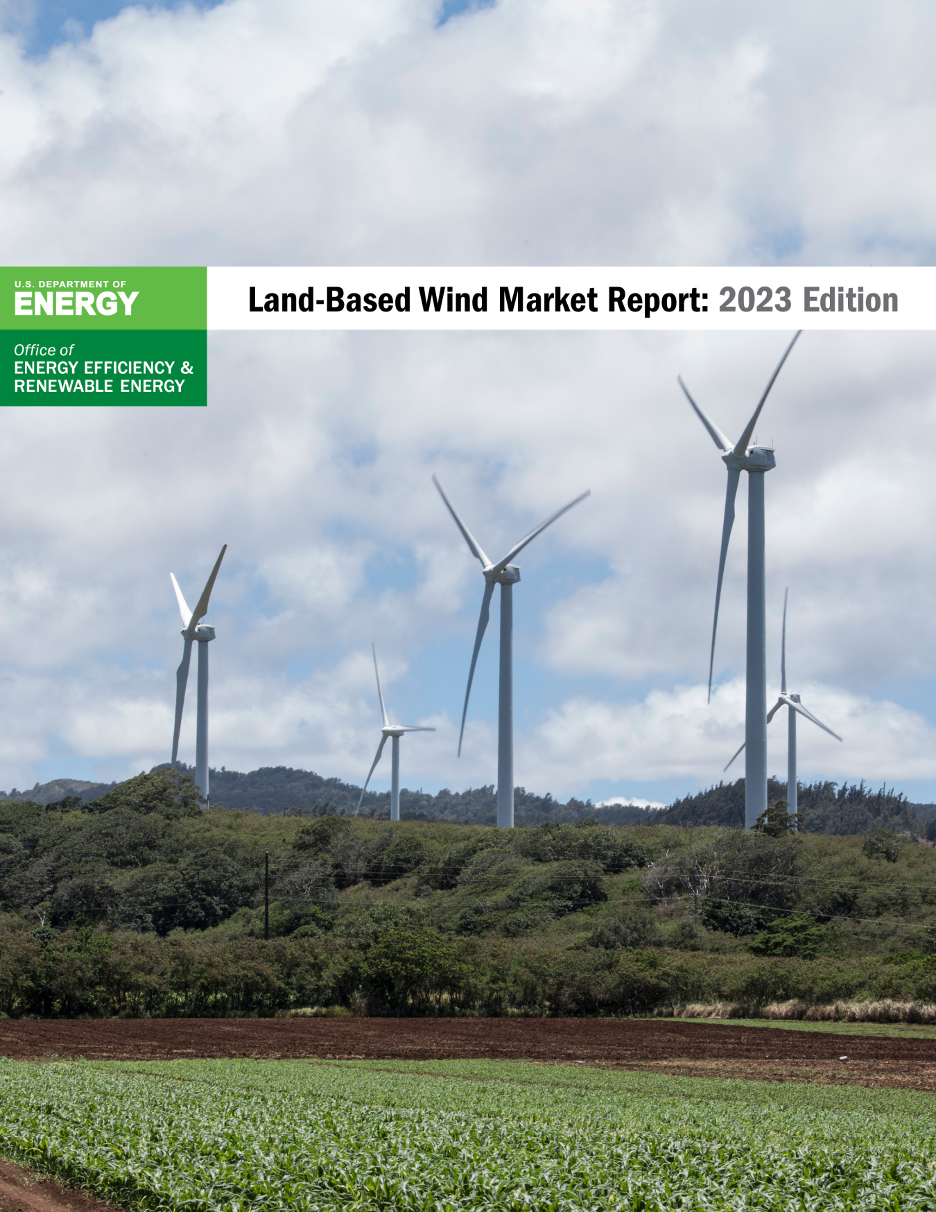 A photo of wind turbines behind a crop field overlain by the U.S. Department of Energy Wind Energy Technologies Office logo and the title Land-Based Wind Market Report: 2023 Edition