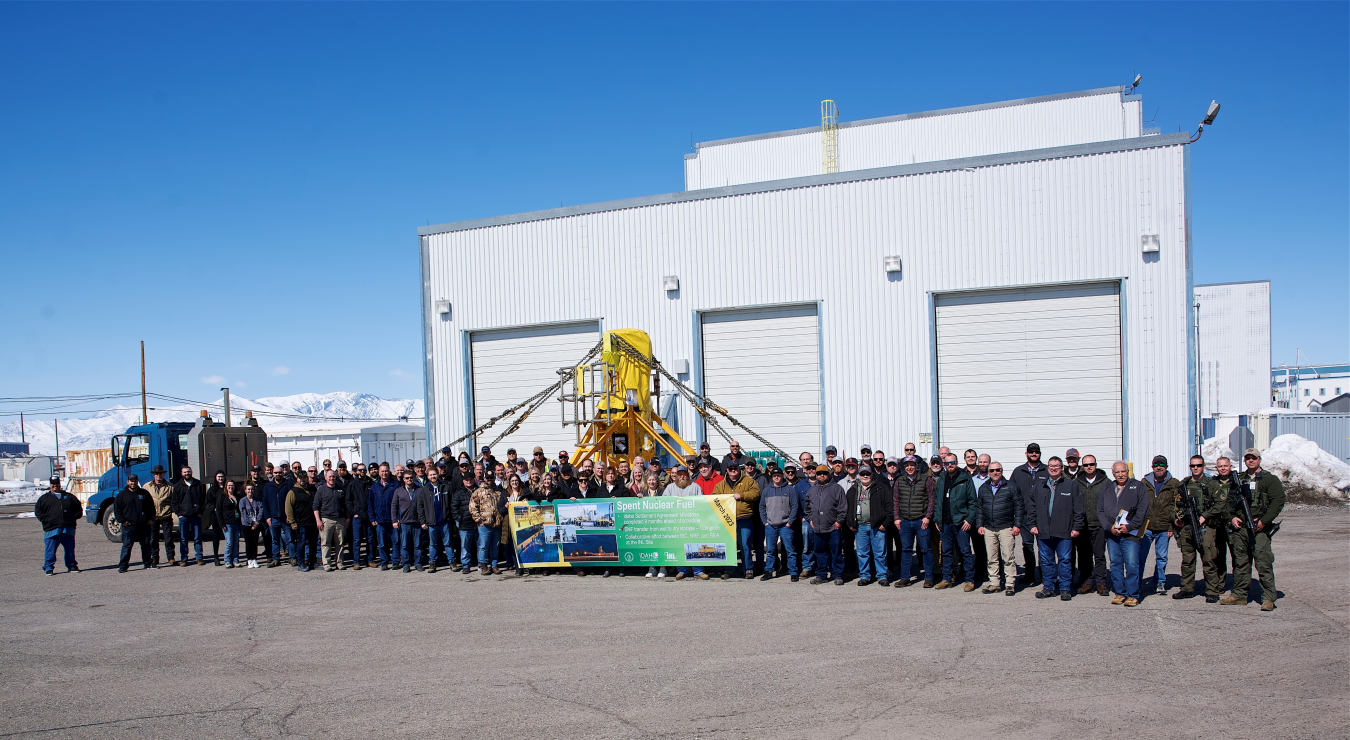 Employees supporting the spent nuclear fuel wet-to-dry project at the Idaho National Laboratory Site celebrate the last fuel elements removed from a water-filled basin within a building at the Idaho Nuclear Technology and Engineering Center. Crews completed the 1995 Idaho Settlement Agreement milestone more than nine months ahead of schedule.