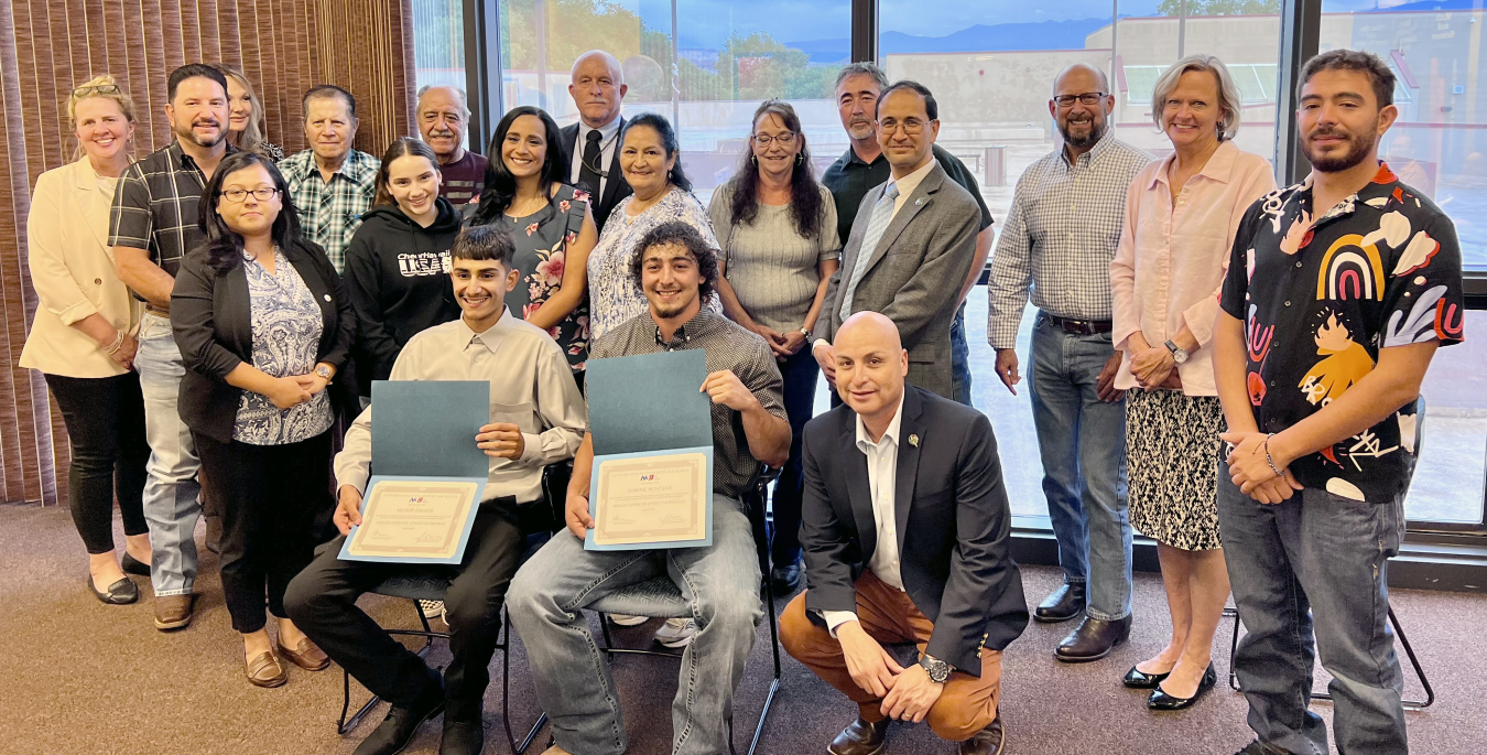 Leaders of Newport News Nuclear BWXT Los Alamos and Northern New Mexico College joined the families and friends of Milnor Branch and Dominic Montaño to celebrate the students’ successful completion of the two-year N3B Nuclear Operator Apprenticeship Program. Branch, at left, and Montaño are shown holding their certificates of completion for the program.