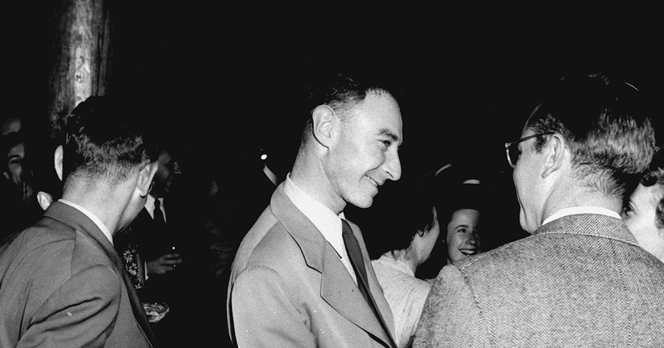 Black and white side profile photo of J. Robert Oppenheimer.