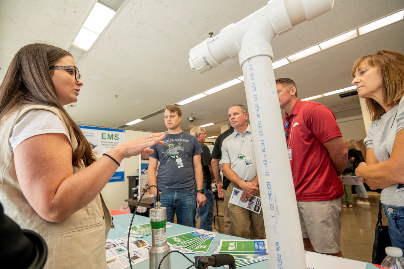 Four Rivers Nuclear Partnership’s Nondestructive Assay Data Analyst Emily Coriell, left, demonstrates the science of robotics and other technologies the Paducah Site uses to prepare buildings for future demolition.