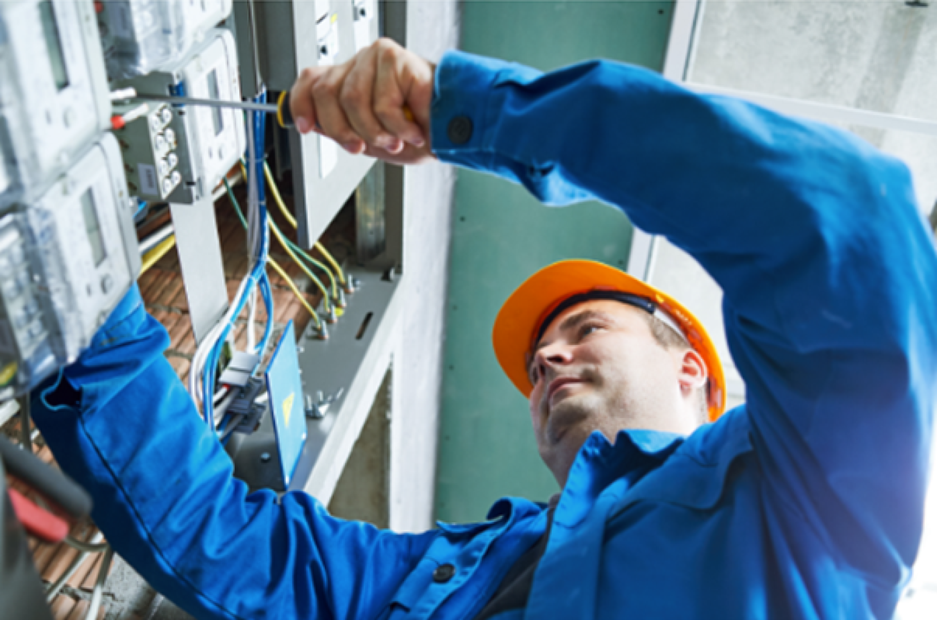 Man working on equipment in safety gear
