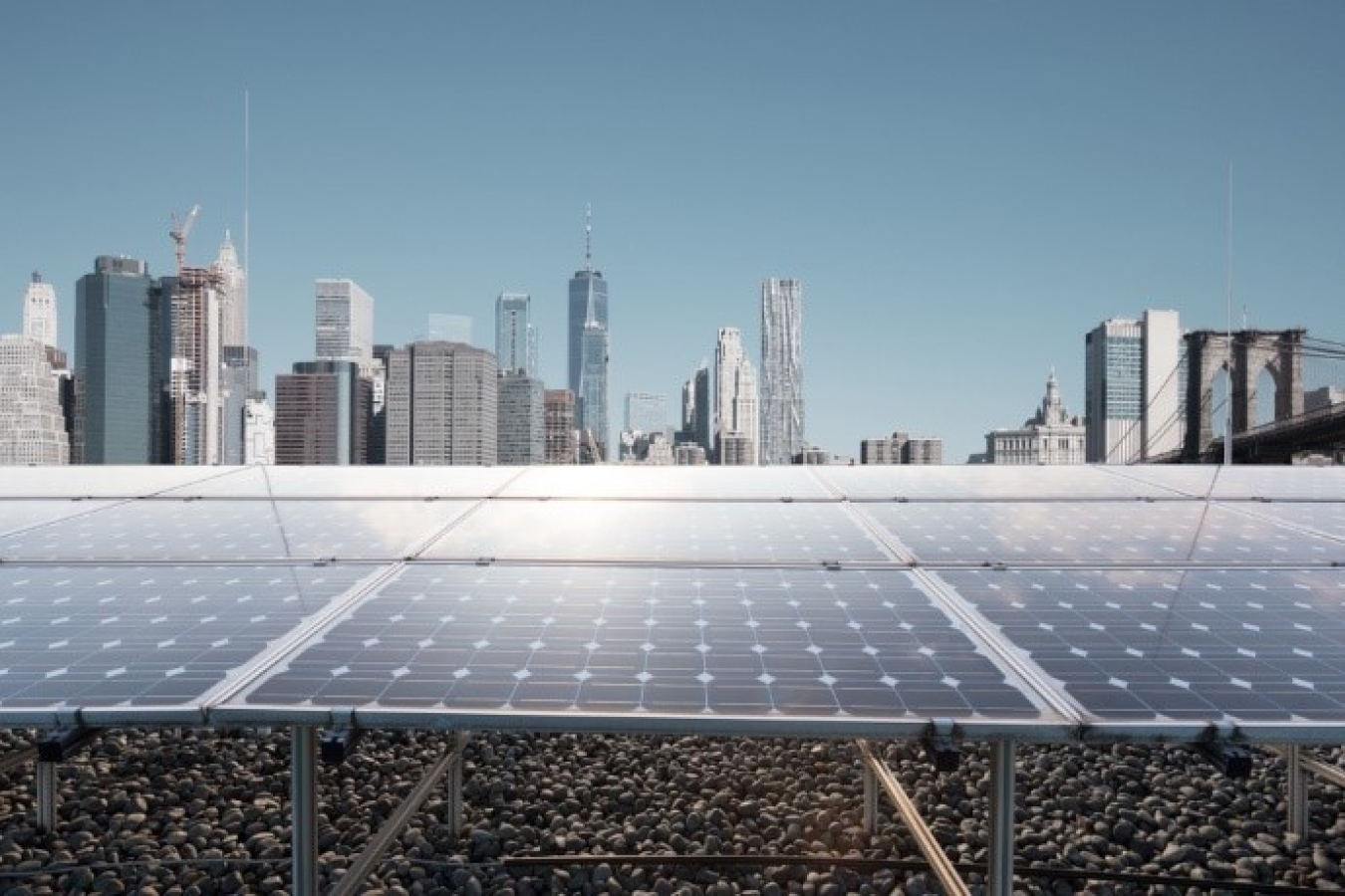 A solar panel in front of a city skyline