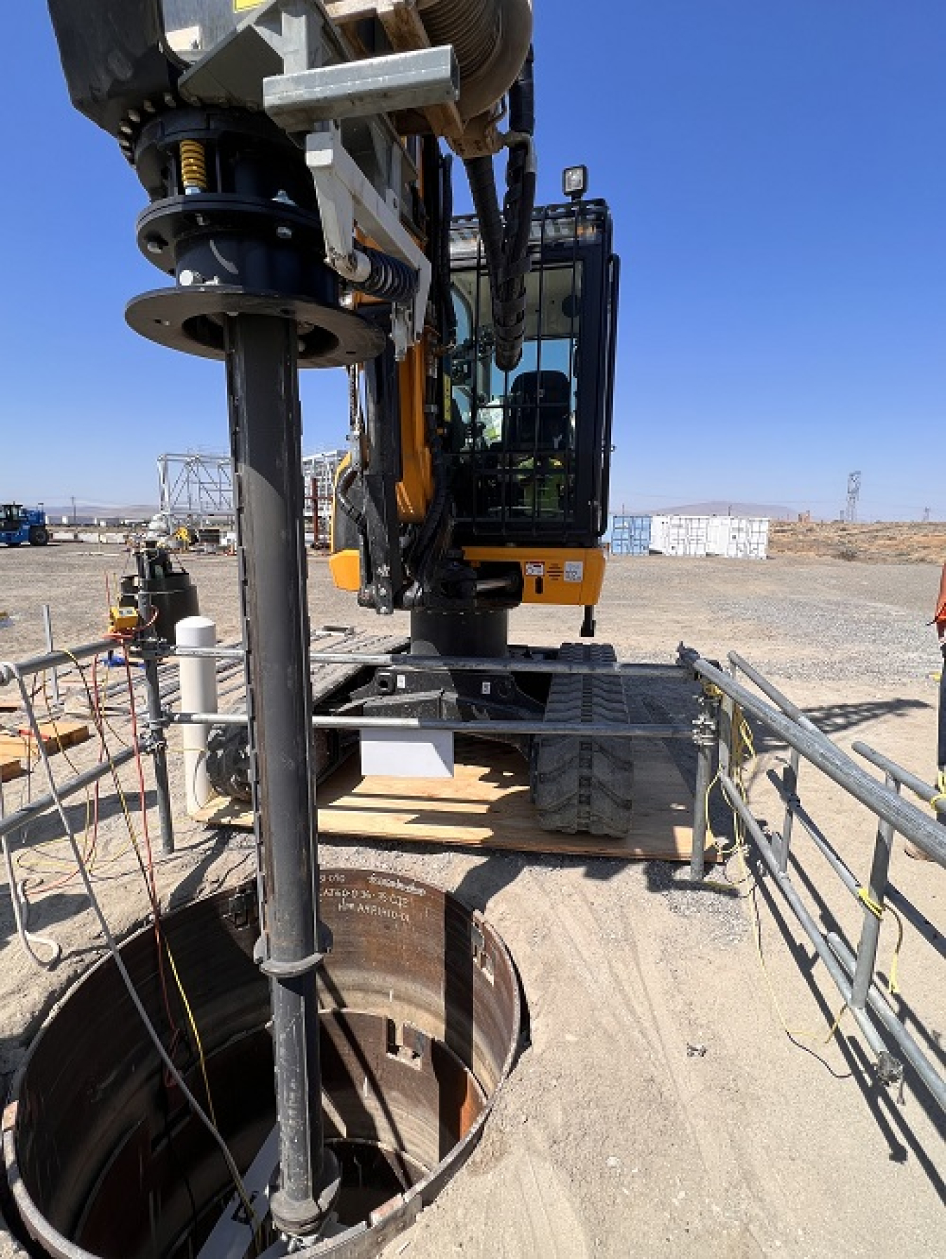 Workers use the Tank Dome Core Cutting System, a modified drilling machine that will create an access hole in the top of an underground waste-storage tank where workers will install equipment to retrieve radioactive and chemical waste from the tank.