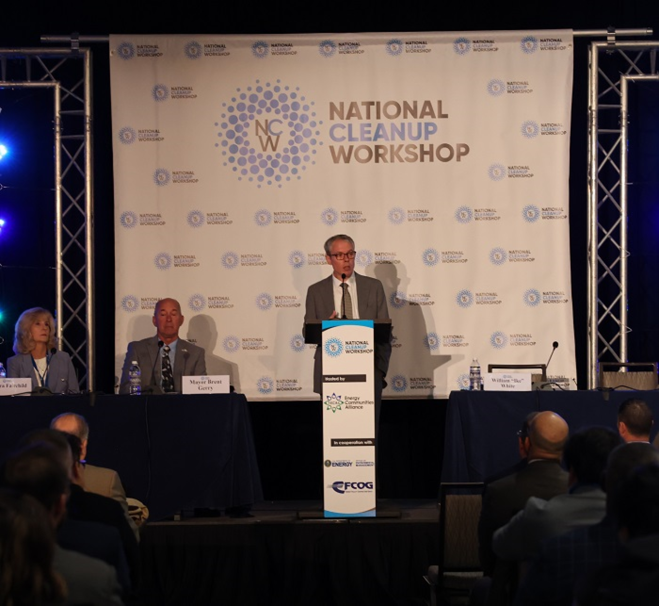 Speaking at podium