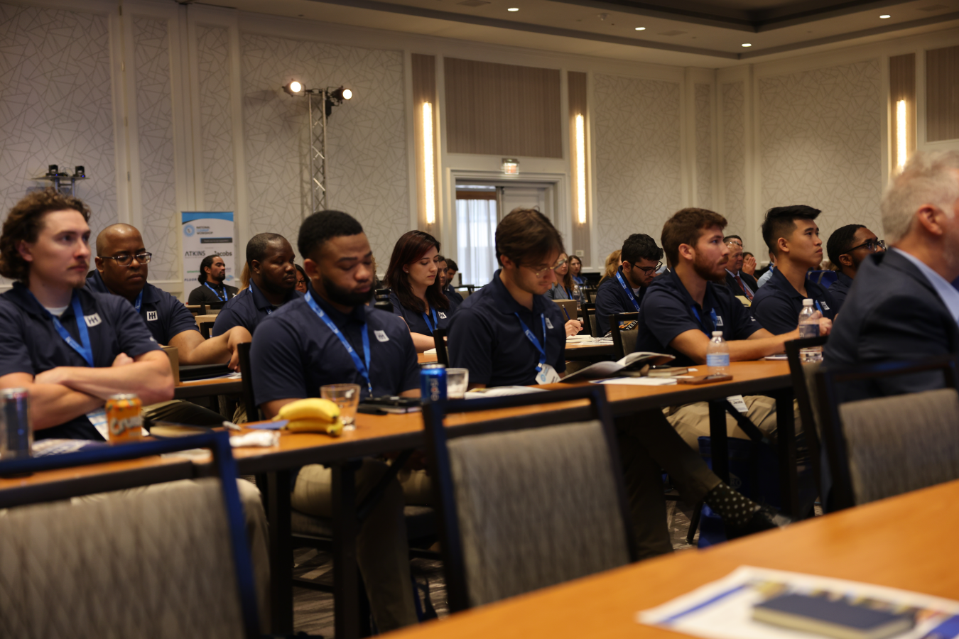 Young professionals watching presentation