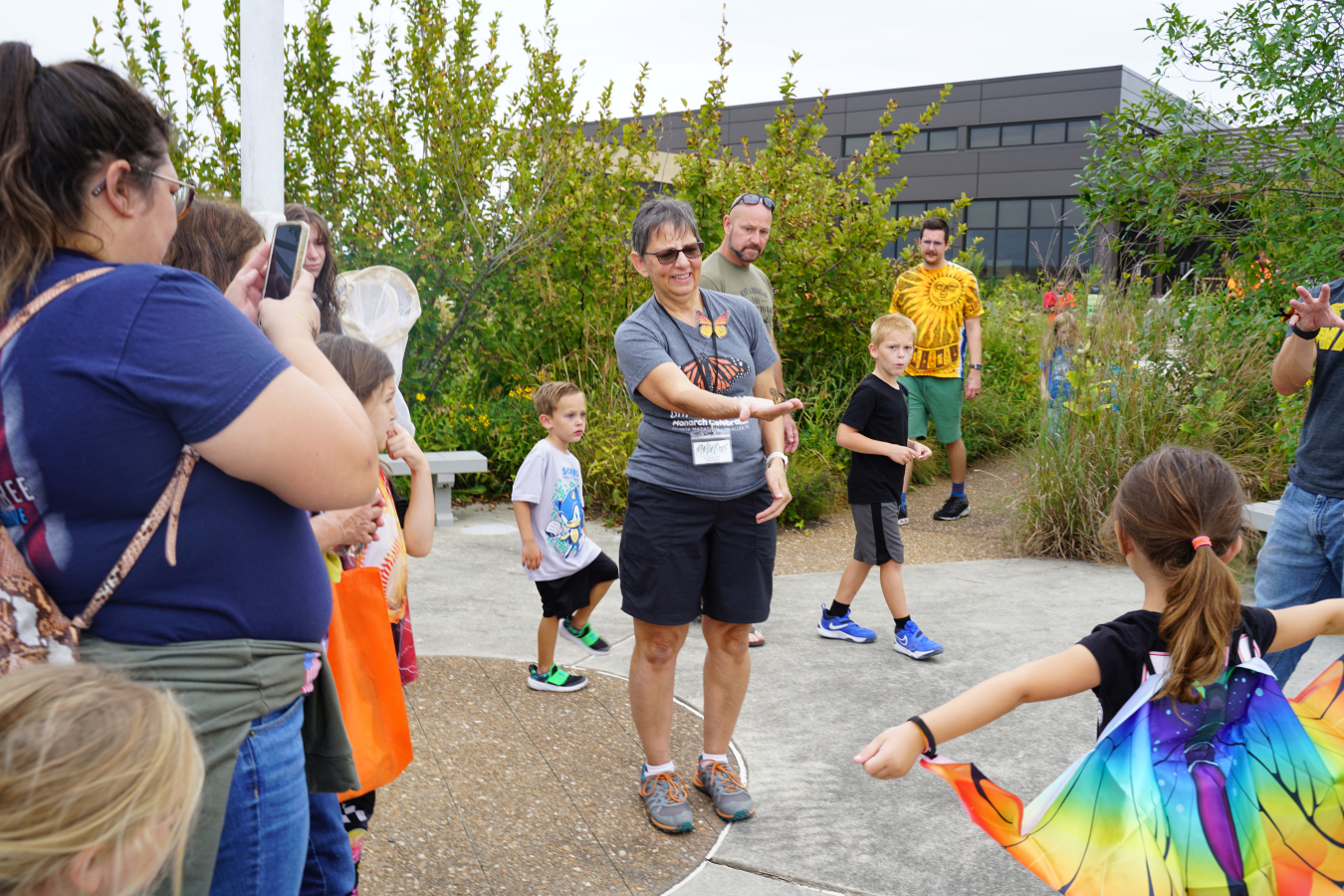 Patty Berry, vice president of Wild Ones for the St. Charles and Surrounding Areas chapter, releases a female monarch butterfly in the garden, after tagging it.