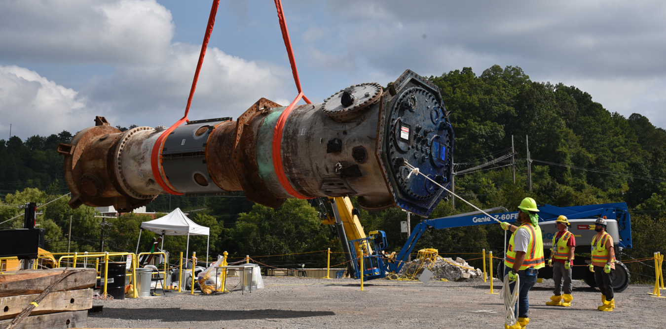 Test Reactor being lifted into the air for removal