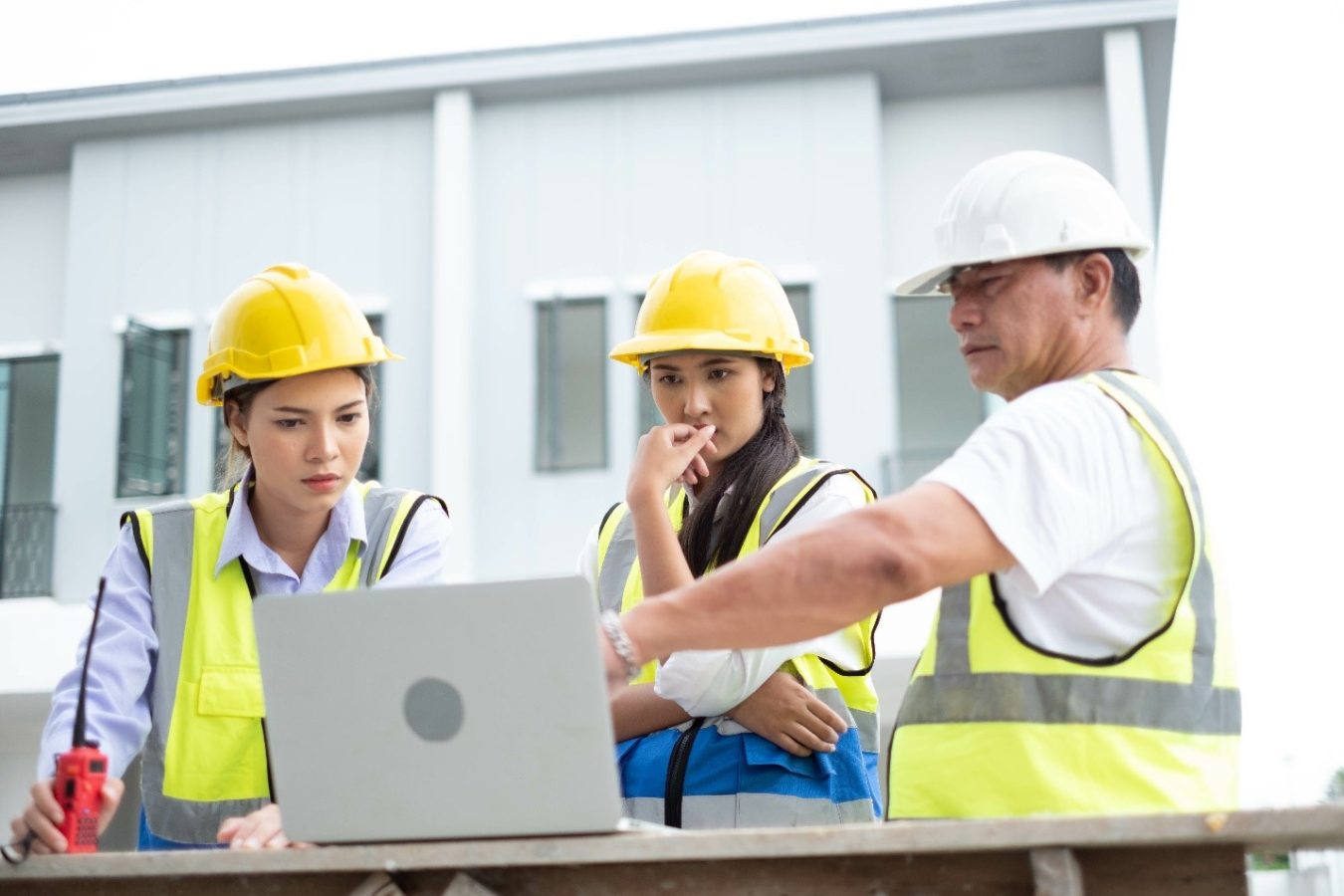 Engineers reviewing building site plans.