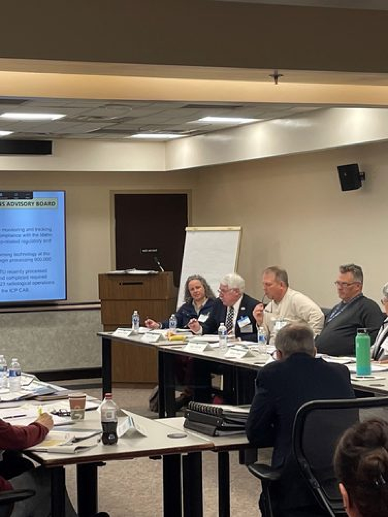 board members sit at a table